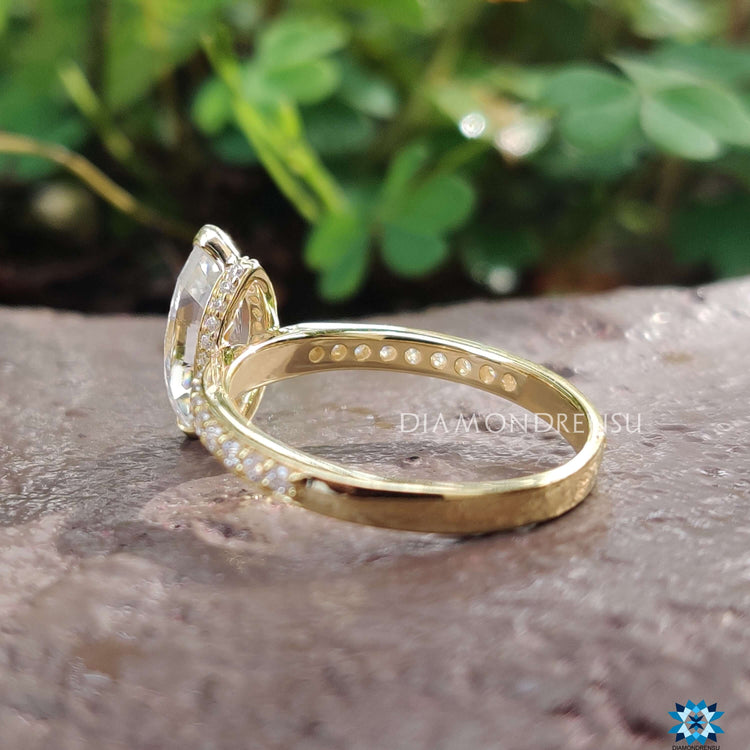 Custom engagement ring featuring marquise and hidden halo.
