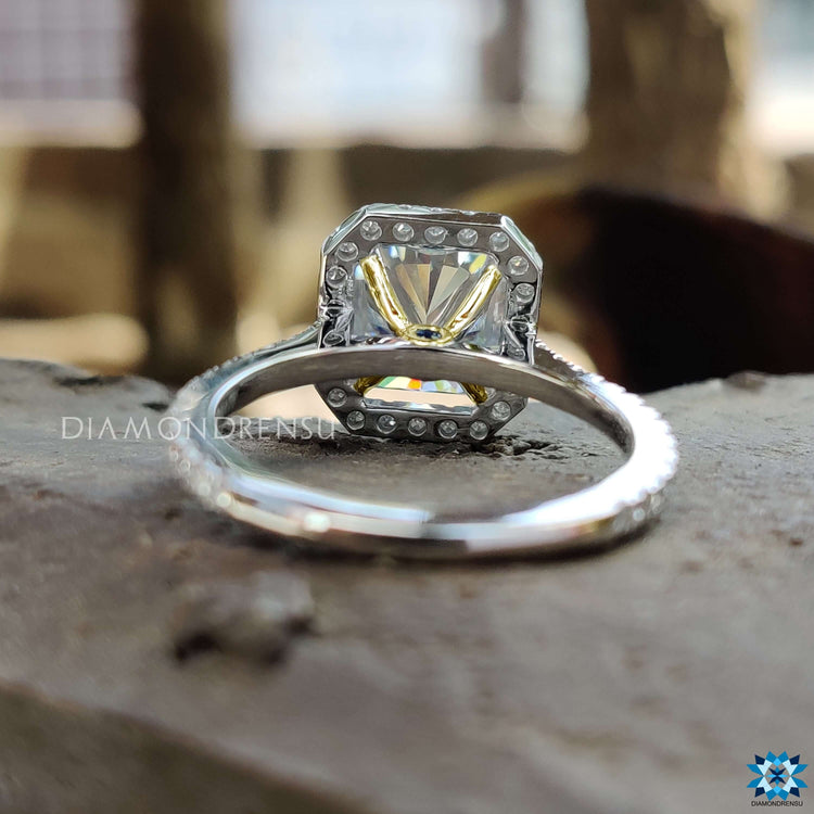 Handmade ring featuring halo and pave band in dual gold tones.
