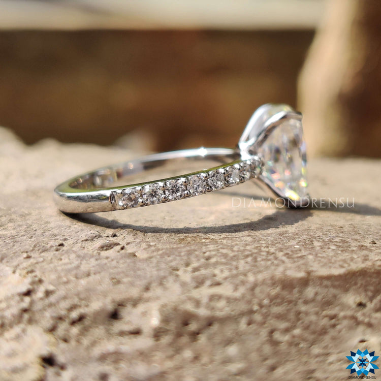Diamondrensu UK white gold moissanite ring with pave band.
