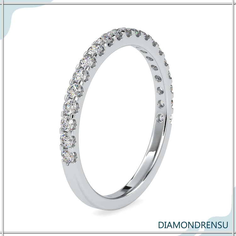 Rose gold half eternity ring with lab made diamonds.
