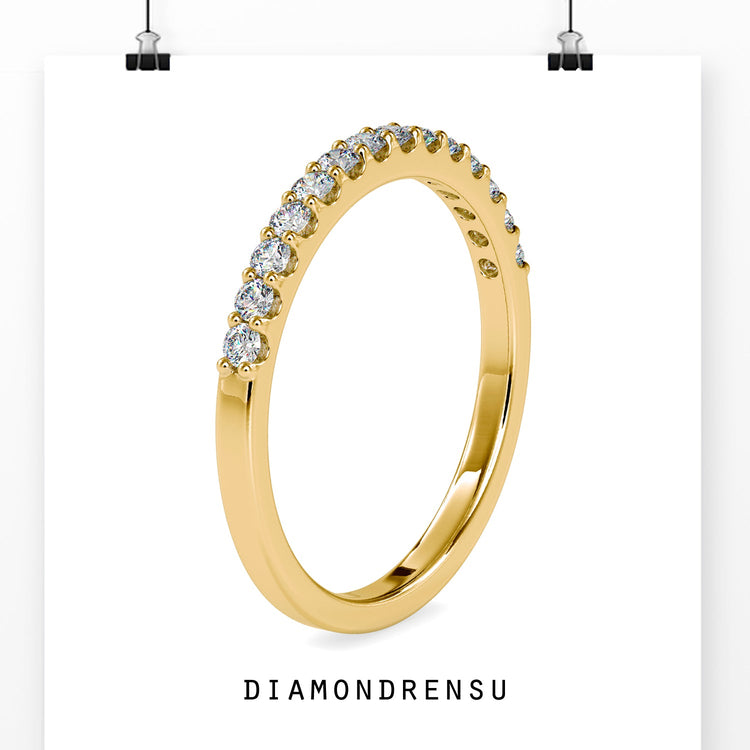 Prong set lab grown diamond wedding band.
