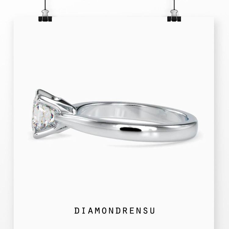 Buy diamond ring with four tab prongs and white gold band.
