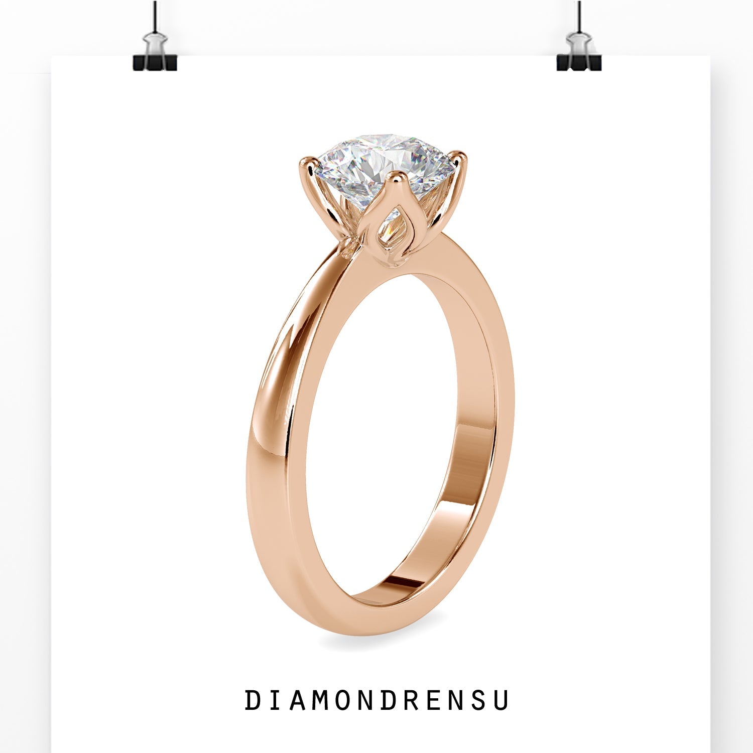 Round solitaire diamond ring set in elegant rose gold.