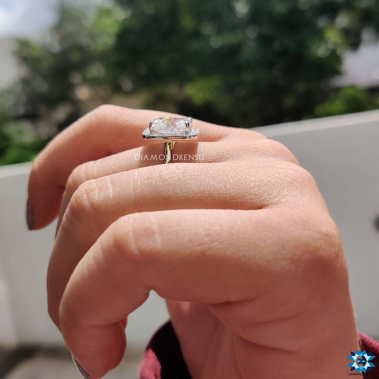 Moissanite engagement ring featuring radiant cut and cathedral setting.
