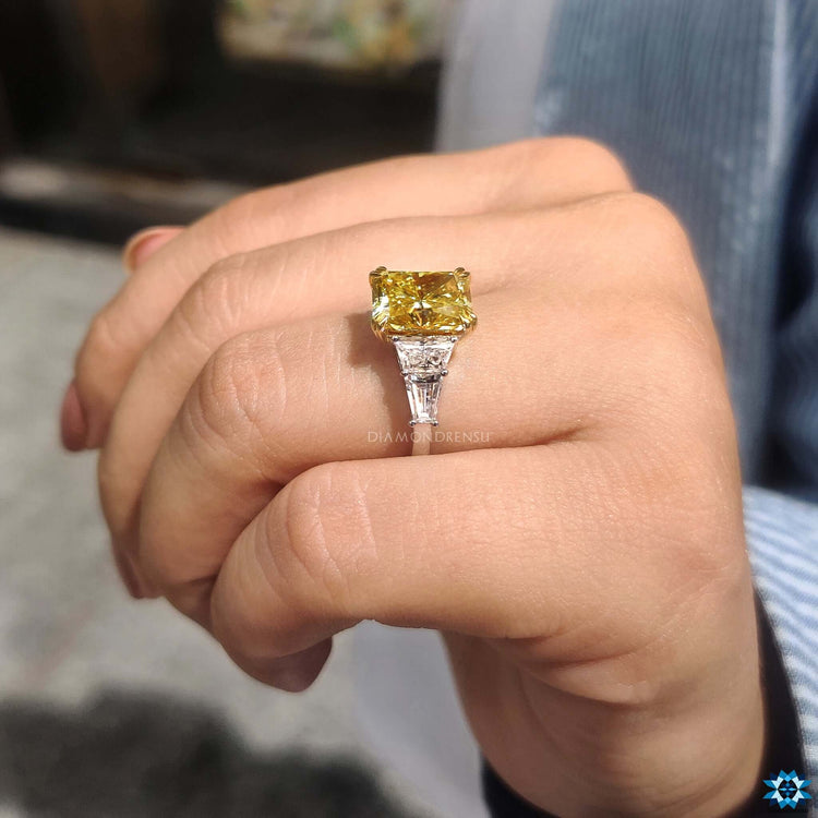 Custom engagement ring featuring a canary yellow center.
