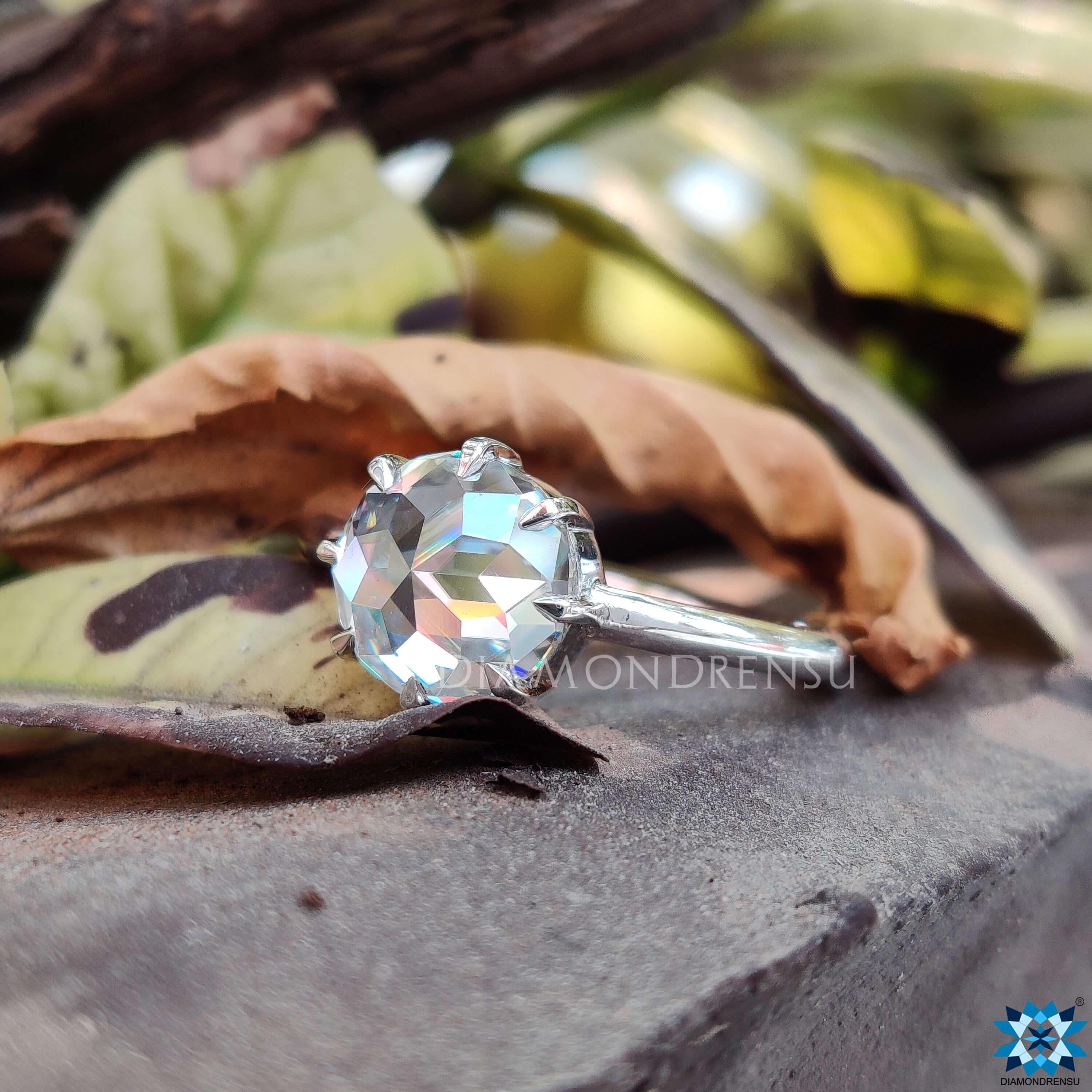 Elegant solitaire engagement ring with a beautiful round cut moissanite ring.