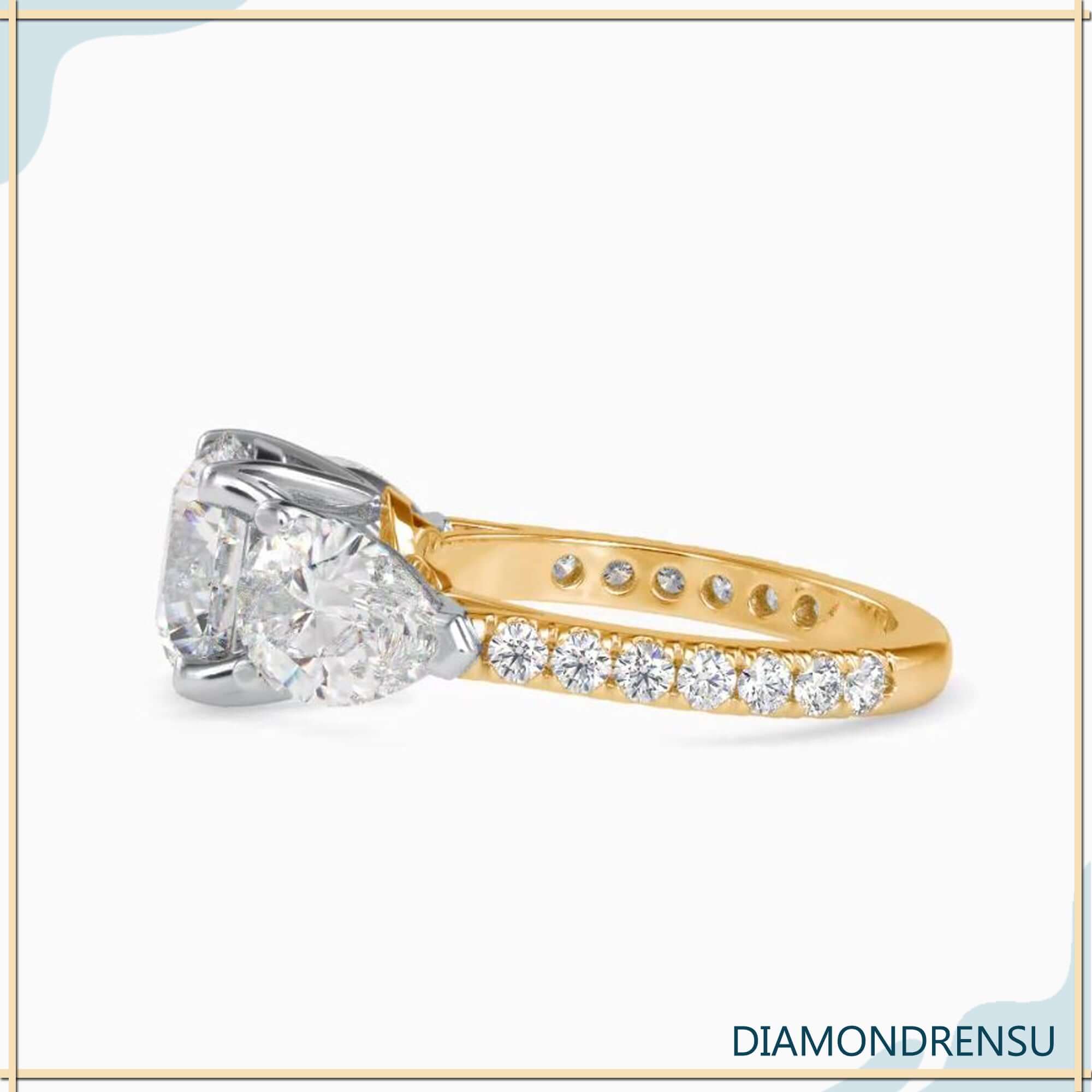 IGI certified handmade ring with round and pear diamonds.