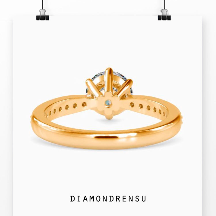 Simple diamond ring with lab grown stone and six prongs.
