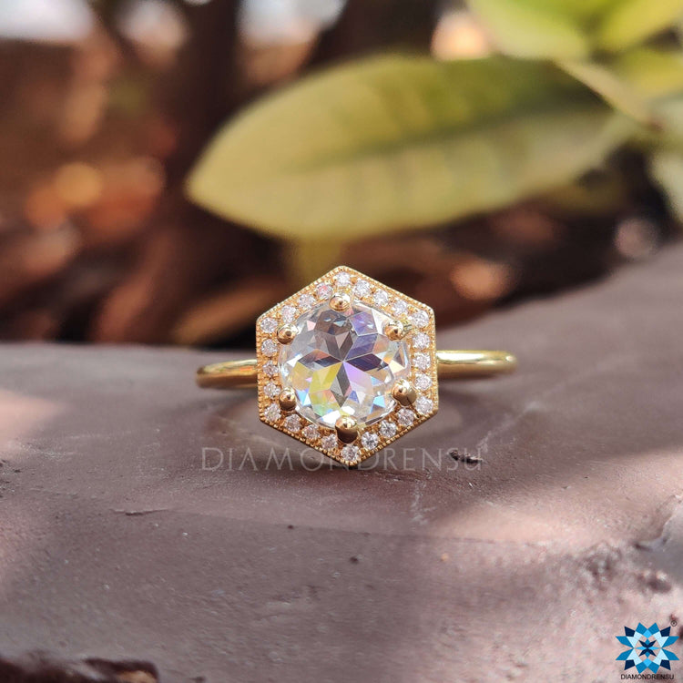 Hexagon outline halo engagement ring.

