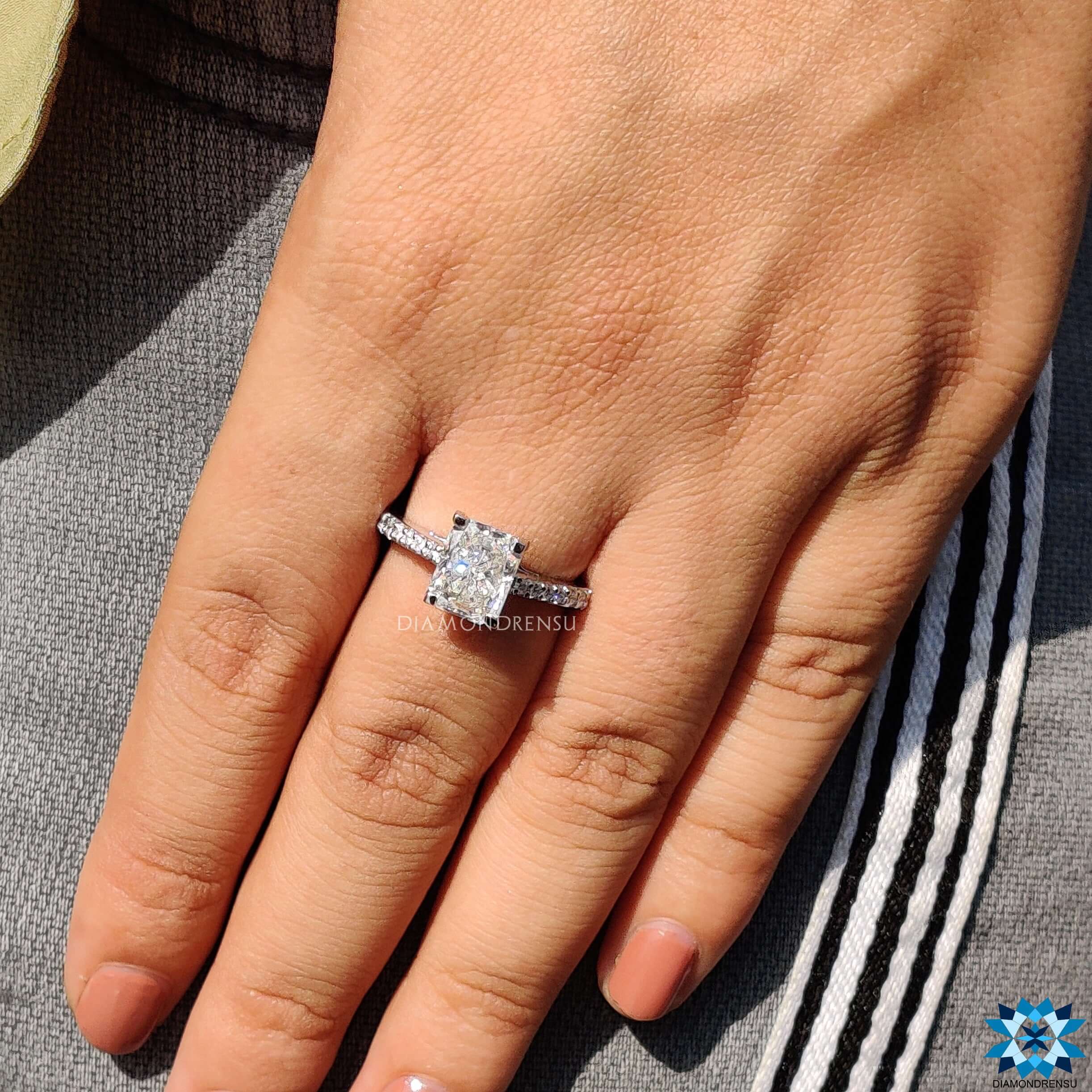 Classic white gold engagement ring featuring a radiant cut diamond.