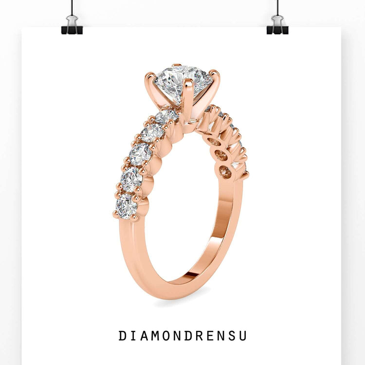 White gold engagement ring with tab prong and round cut centre.
