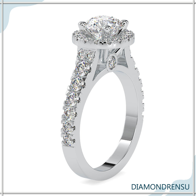 White gold engagement ring with round cut halo style.
