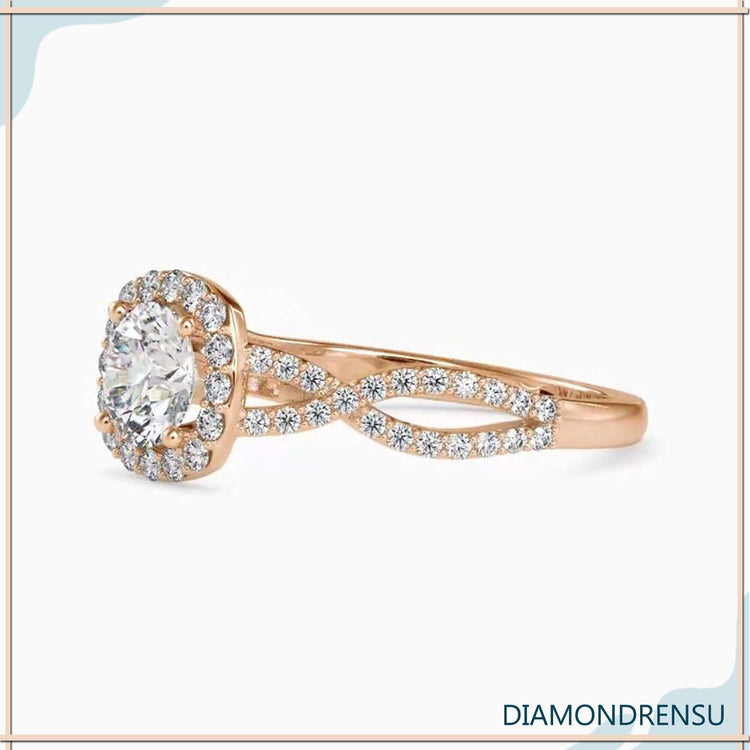 Rose gold ring with round diamond in a 4 prong halo setting.
