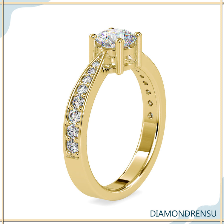 Tapered shank ring holding a secure round diamond.
