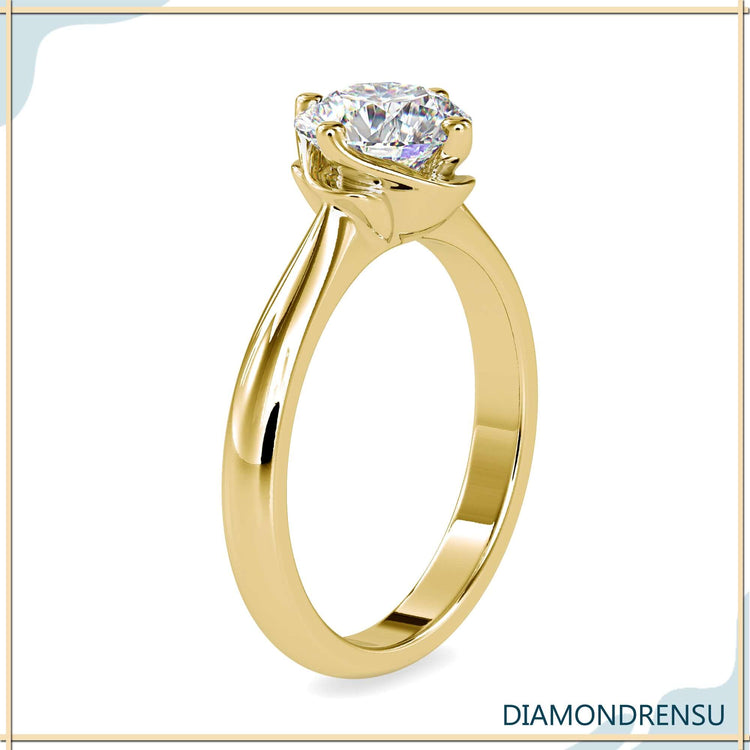 UK engagement ring with clean solitaire design.
