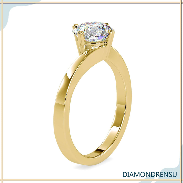 Rose gold engagement ring in solitaire bypass design.
