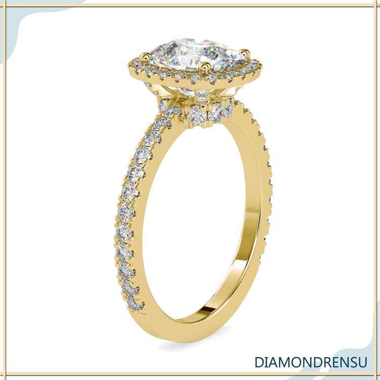 Rose gold diamond ring with cushion centre stone.
