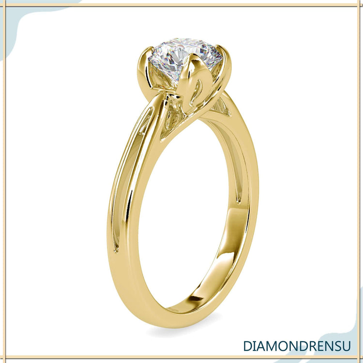 Round diamond ring in a petal prong solitaire setting.

