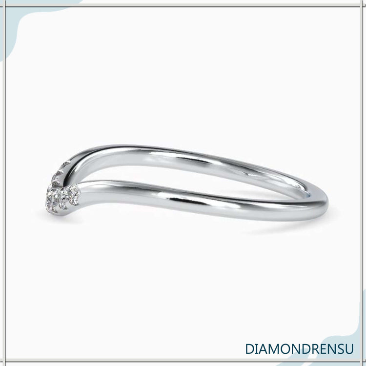 Rose gold curved band with lab grown diamonds.

