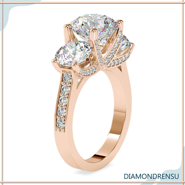 Designer ring with pave band and 3 round diamonds.
