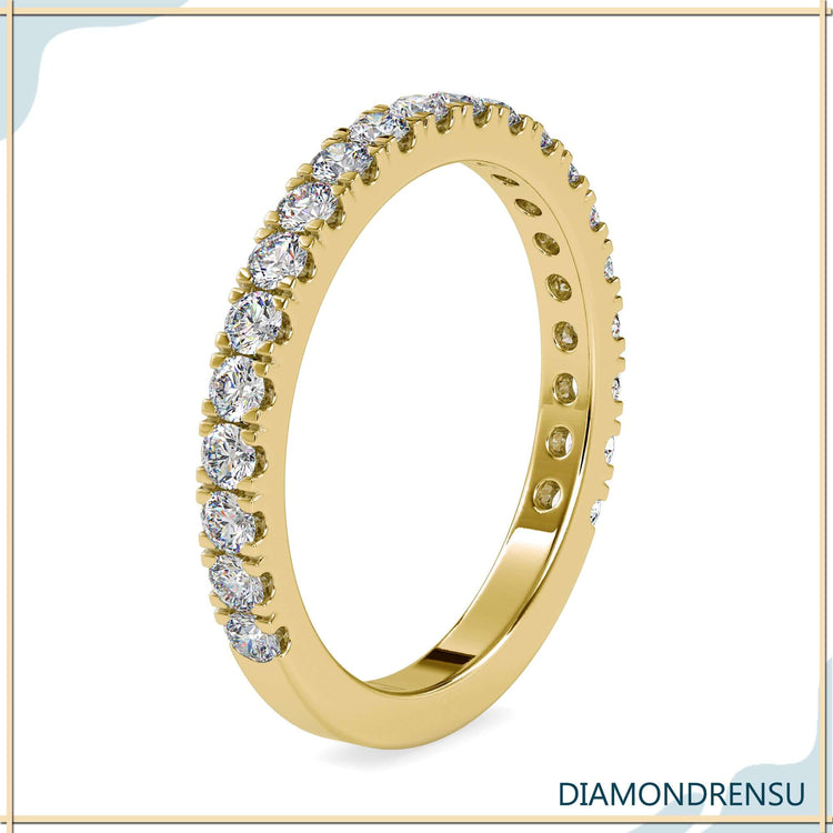 Handmade white gold band with round cut lab diamonds.
