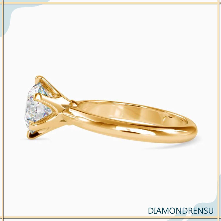 Designer 6 prong setting round diamond ring.
