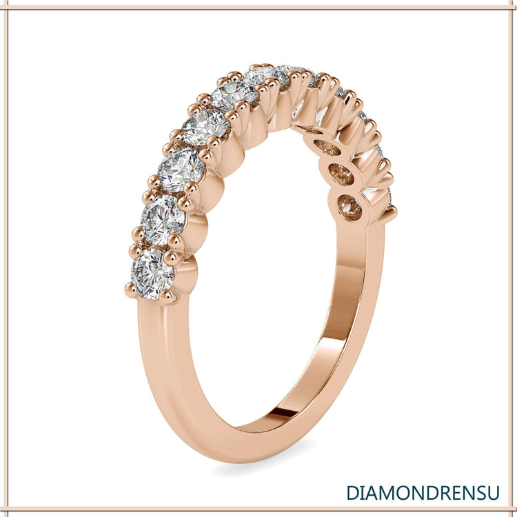 Handmade white gold half eternity ring with prong setting.
