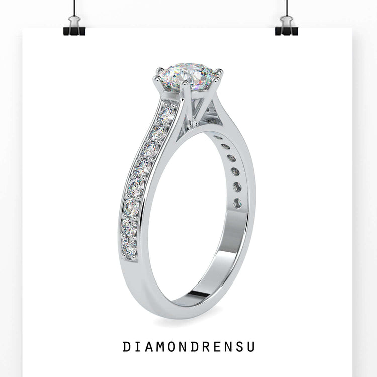 Channel set engagement ring with lab grown centre diamond.
