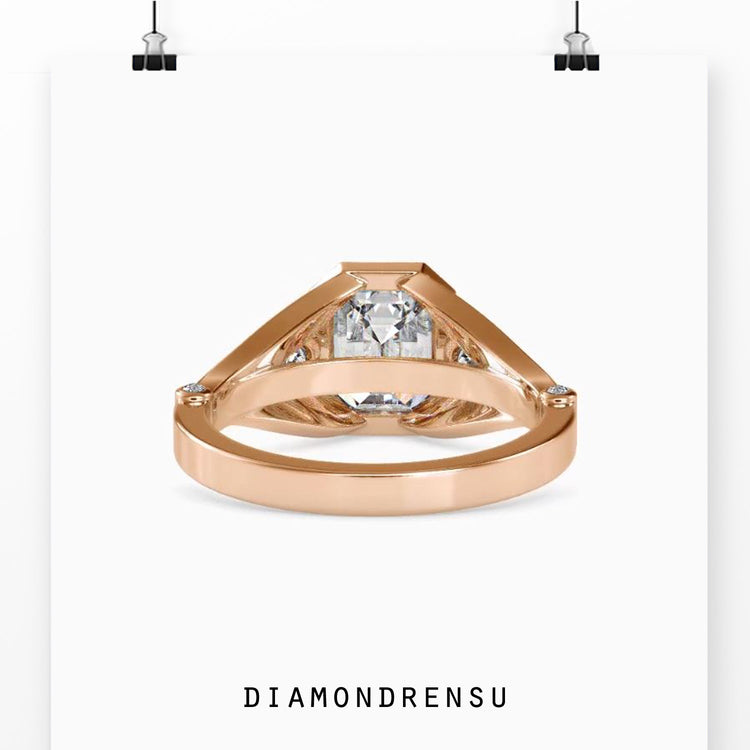 Simple diamond ring with custom bezel and three stones.
