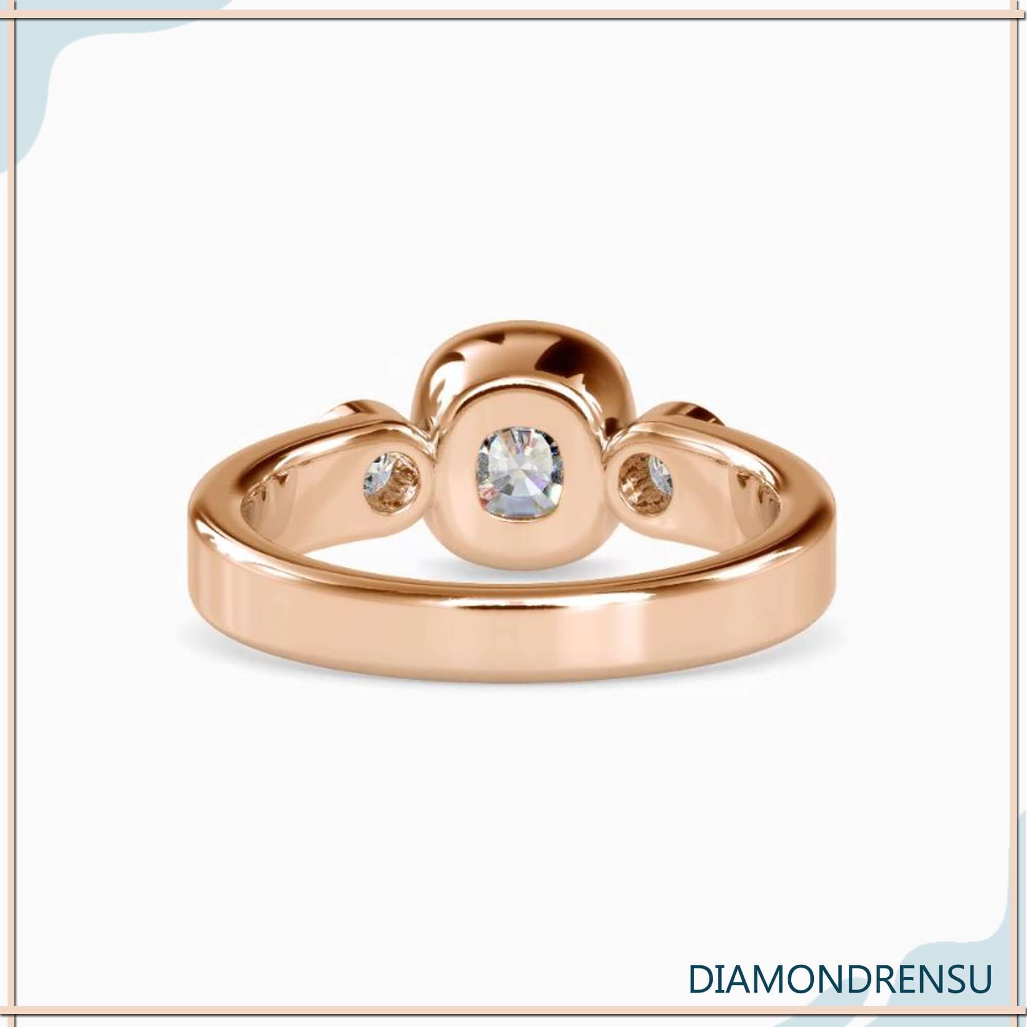 Bezel setting ring featuring a cushion diamond and trapezoid side stones for a modern twist.
