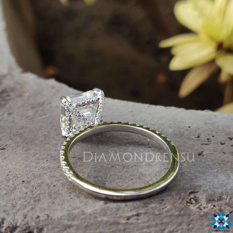 Diamondrensu UK ring featuring Asscher cut Moissanite and hidden halo accent.
