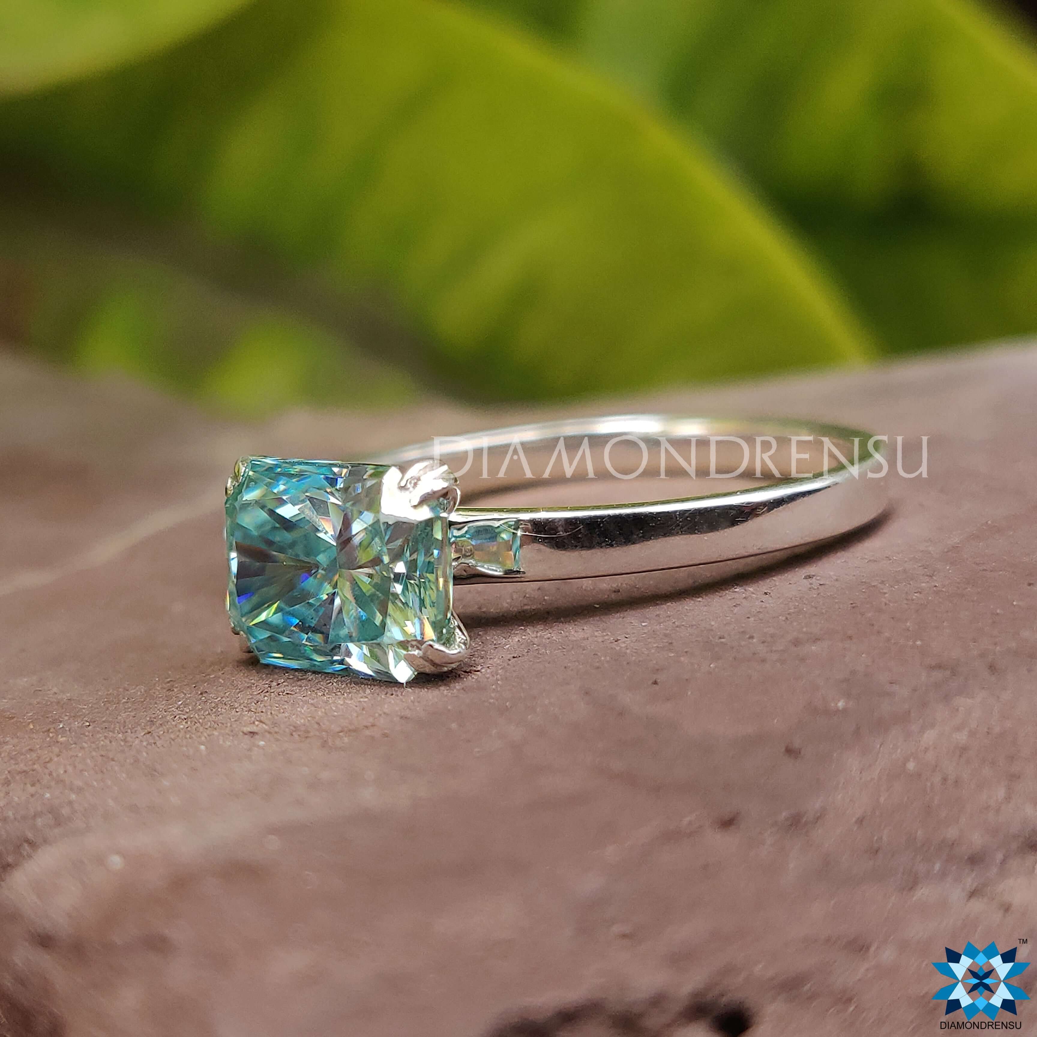 Custom ring featuring a blue moissanite gemstone.