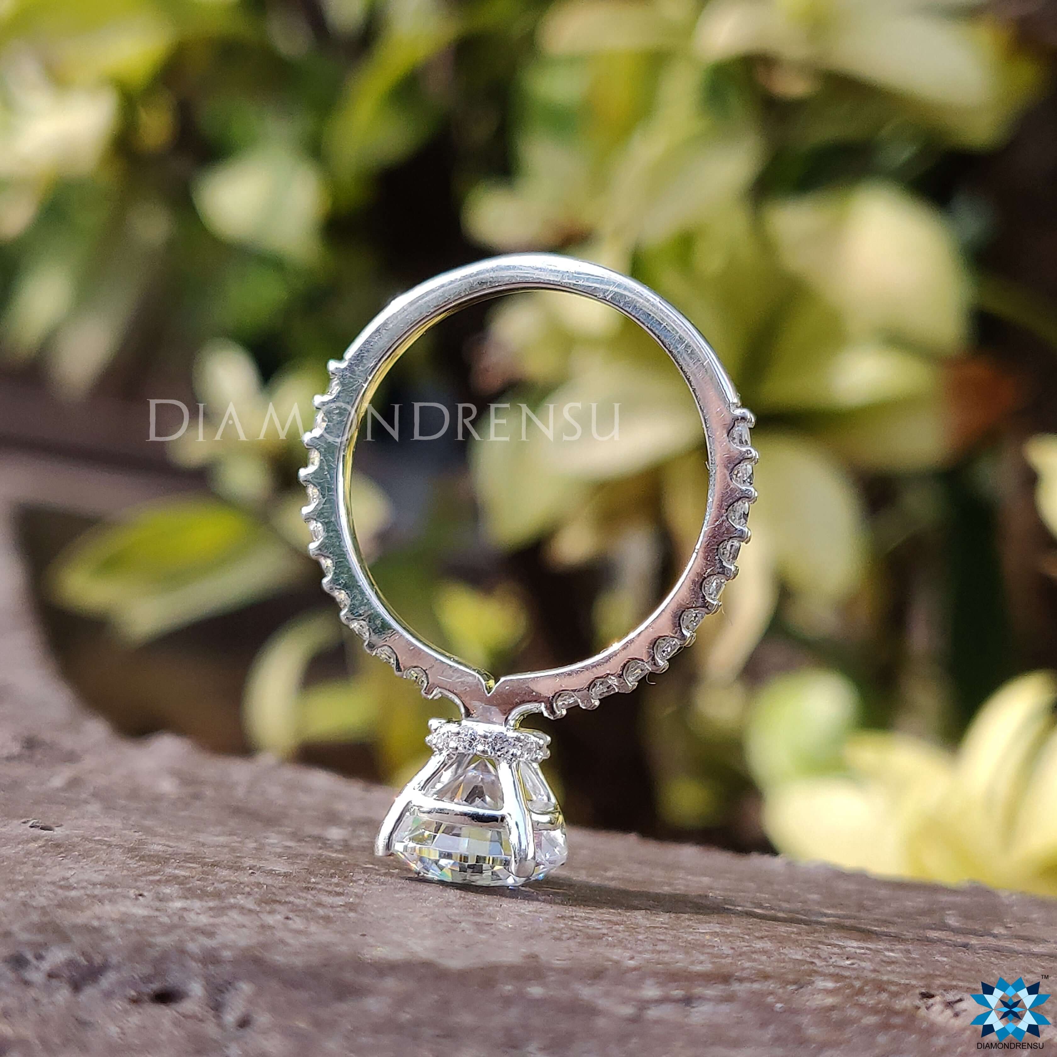 White gold moissanite ring with a secure tab prongs setting for brilliance.