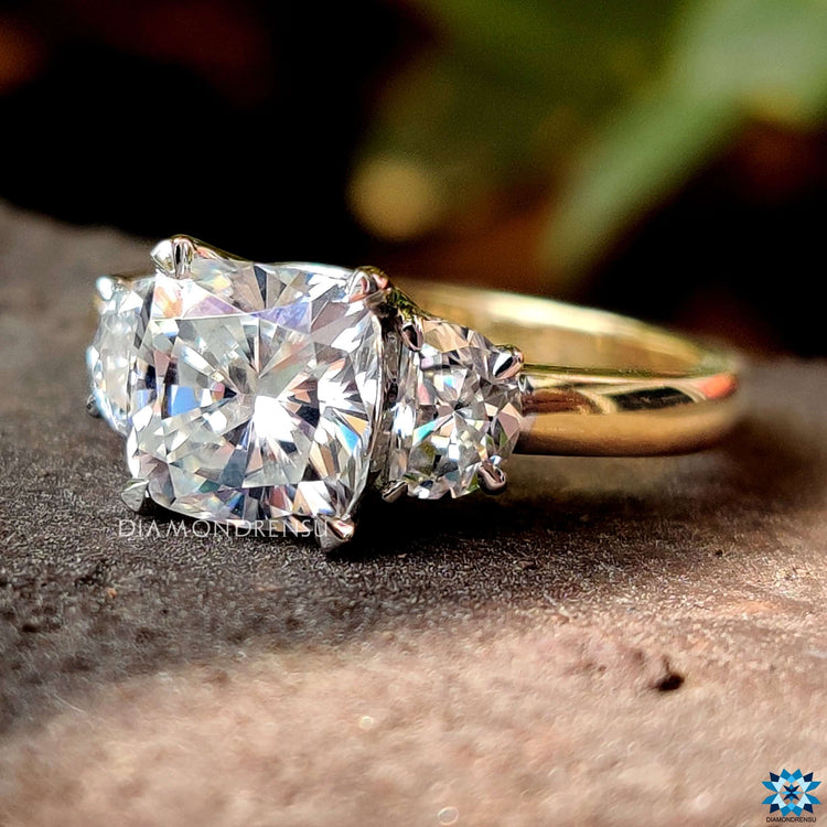 Cushion cut center stone with claw prong setting.
