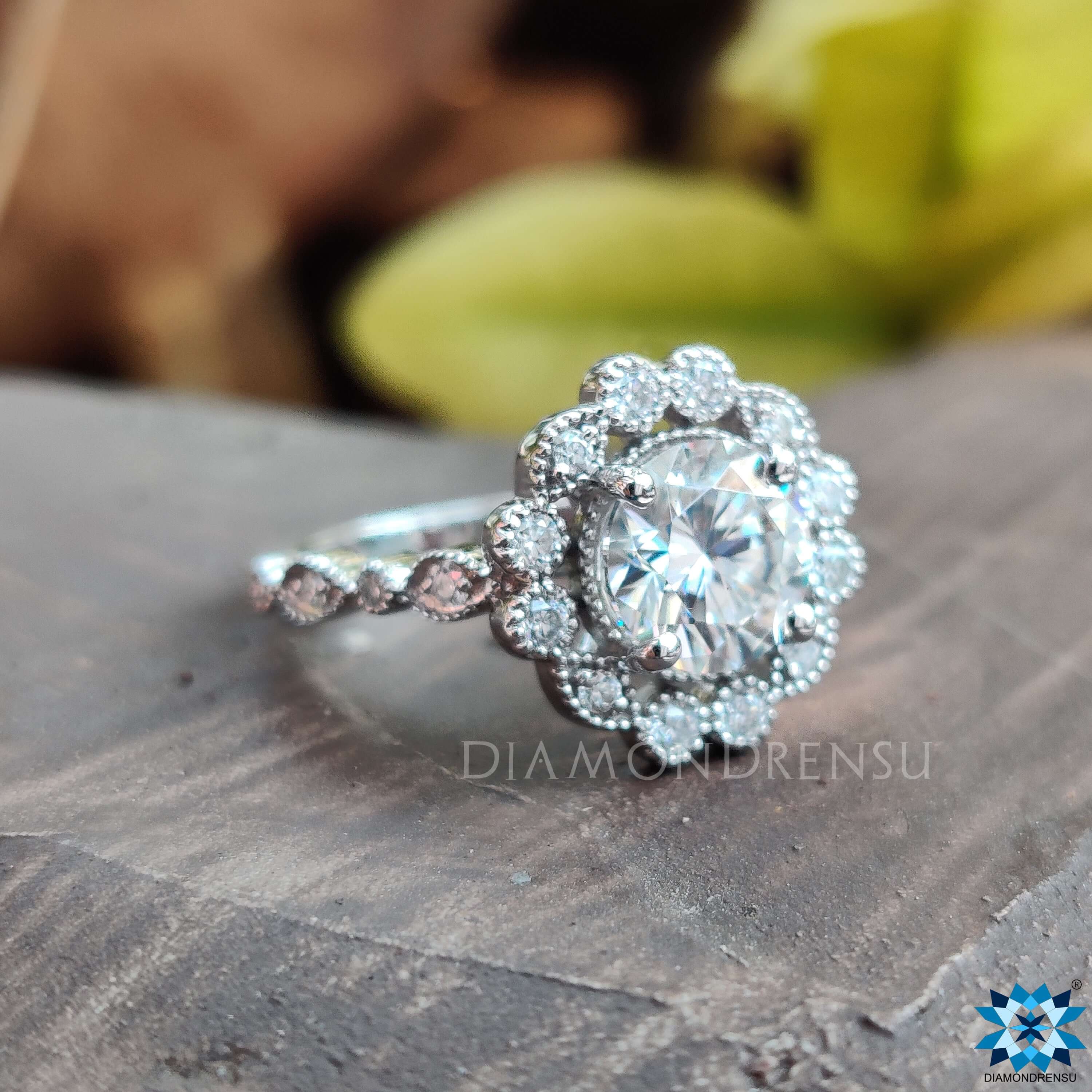 Classic white gold engagement ring with a shimmering moissanite centre.
