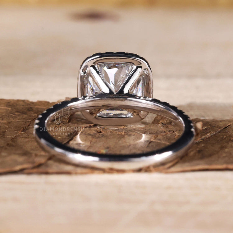 Cushion engagement ring halo with a pave setting, ideal for a modern yet timeless style.
