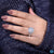 Moissanite pave ring with handmade round cut and cushion setting style.

