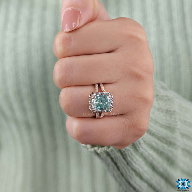 Split pave ring featuring light blue moissanite.
