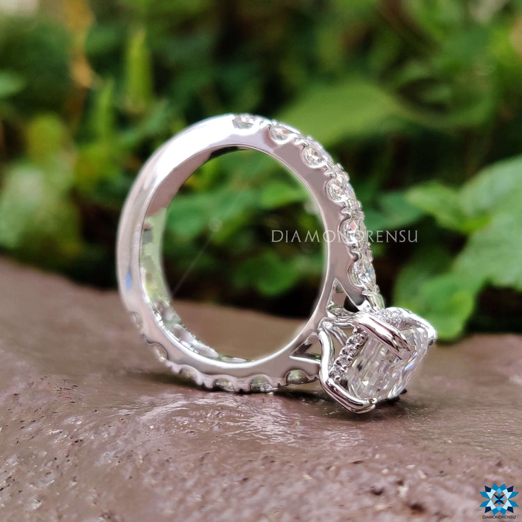 White gold ring with pave and prong settings.
