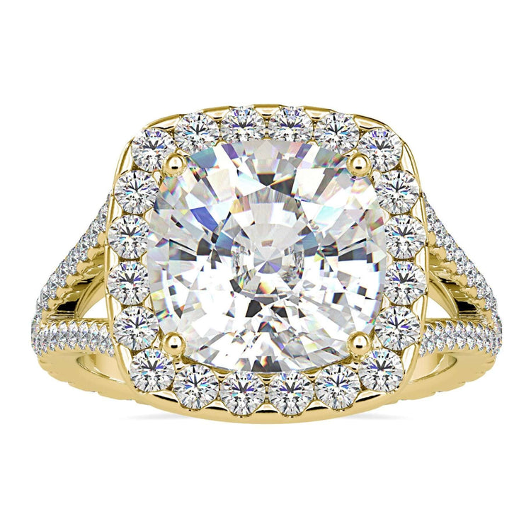 Cushion cut halo engagement ring with split shank design.
