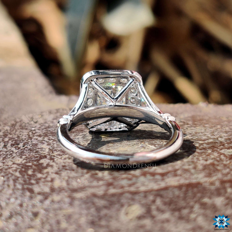 White gold moissanite ring with 4 prong claw setting.

