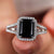 black moissanite engagement ring