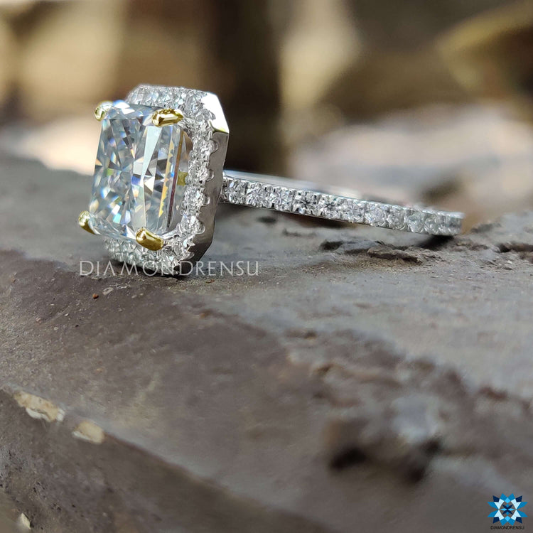 Moissanite halo ring with peekaboo blue hidden gem.

