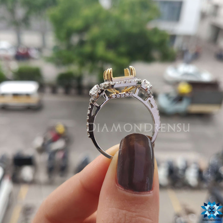 Double prong setting on moissanite engagement ring.
