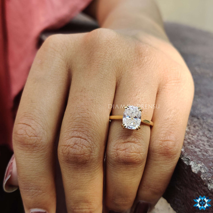 Moissanite solitaire ring in gold.
