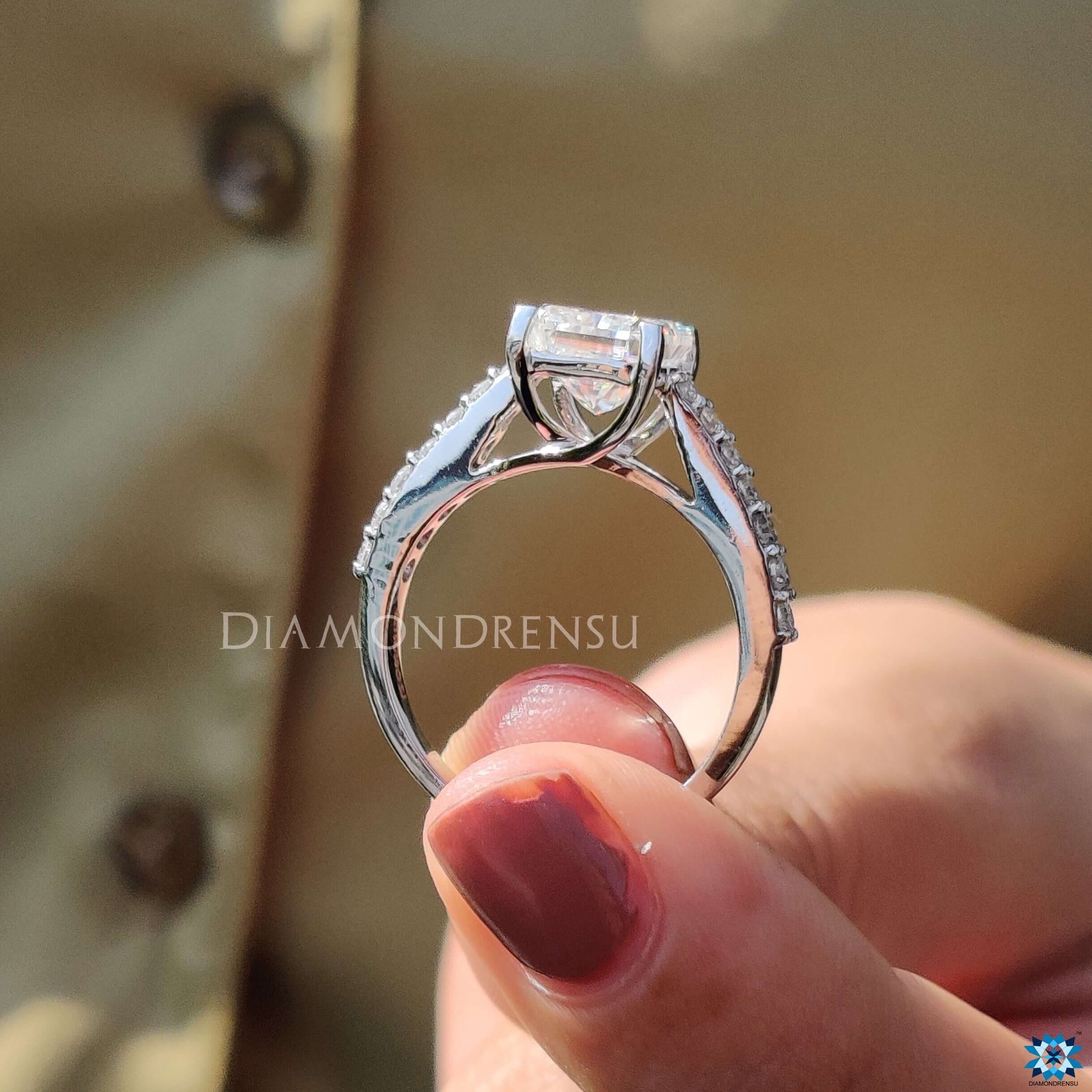 4 prong engagement ring holding a radiant cut centre stone for maximum sparkle.