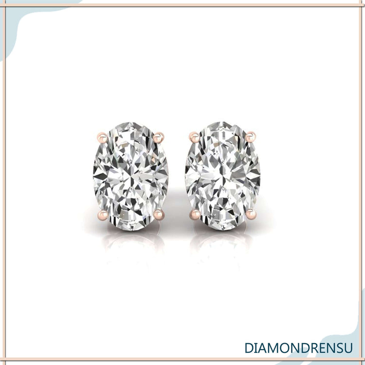 Handmade rose gold oval diamond stud earrings with secure basket setting.
