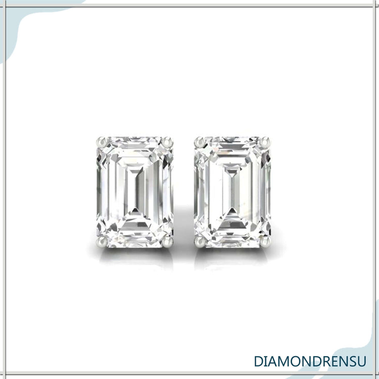 Gold diamond earrings featuring emerald shaped centres.

