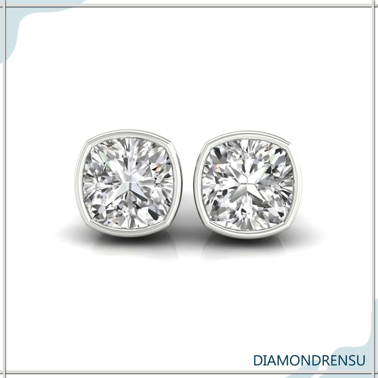 Lab grown diamond earrings in cushion cut bezel design.
