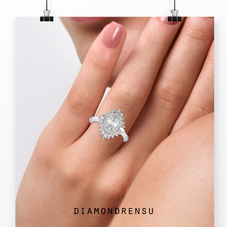 Oval cut diamond ring with tapered baguette halo.
